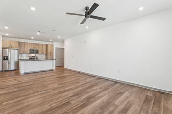 A room with a ceiling fan and wooden flooring at The Junction at Rockledge Apartments, Rockledge 32955